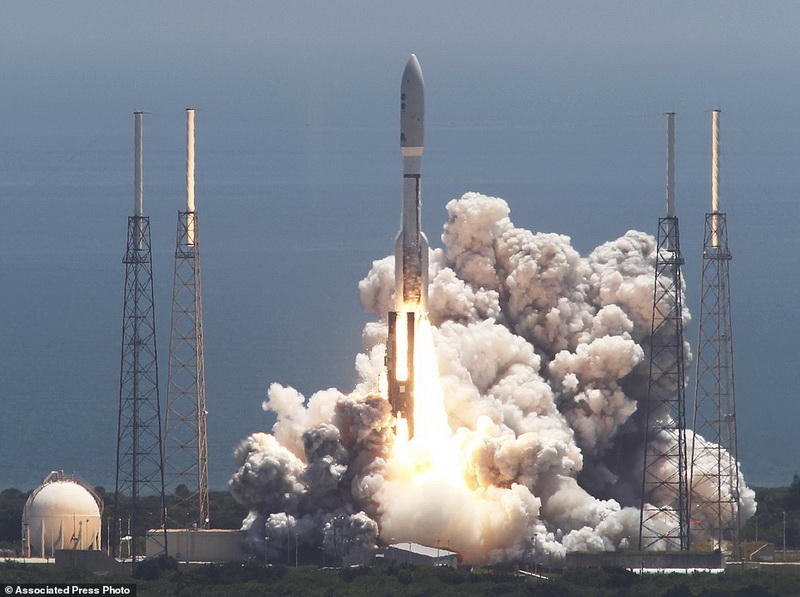FILE - In this Friday, Aug. 5, 2011 file photo, an Atlas V rocket carrying the Juno spacecraft lifts off from Space Launch Complex-41 in Cape Canaveral, Fla. It was the first step in Juno's 1.7 billion-mile voyage to the gas giant planet, Jupiter. (AP Photo/Terry Renna)