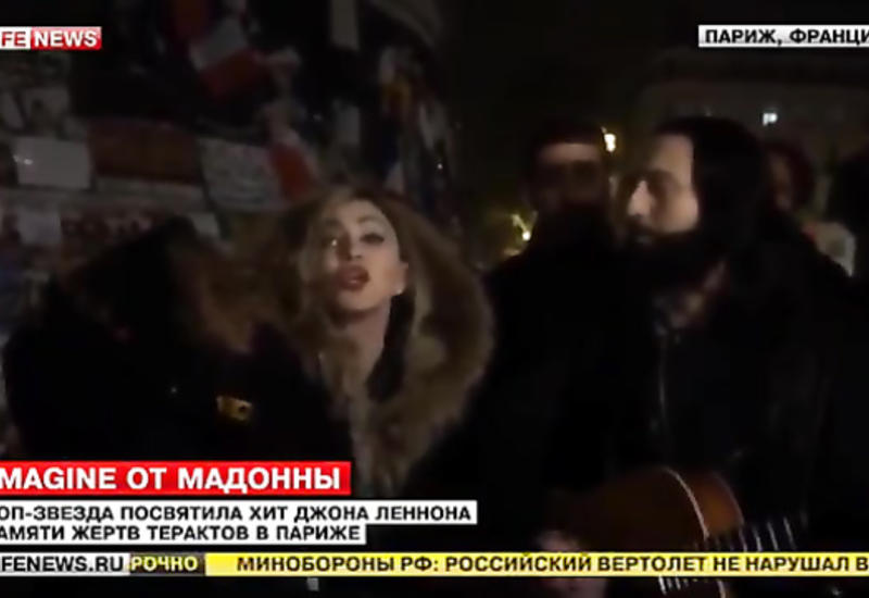 Мадонна с сыном спела на улице Парижа