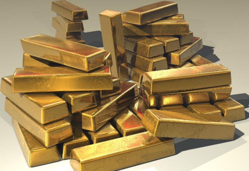 Стоимость золота стабилизировалась вопреки сильному доллару