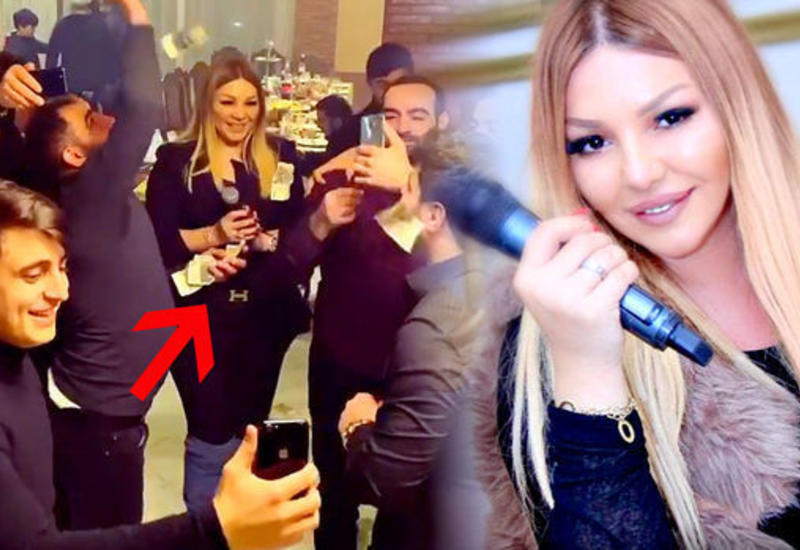 Азербайджанскую певицу осыпали деньгами, которые собрали веником