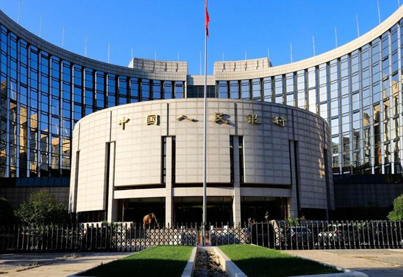 Центробанк Китая понизил курс юаня к доллару